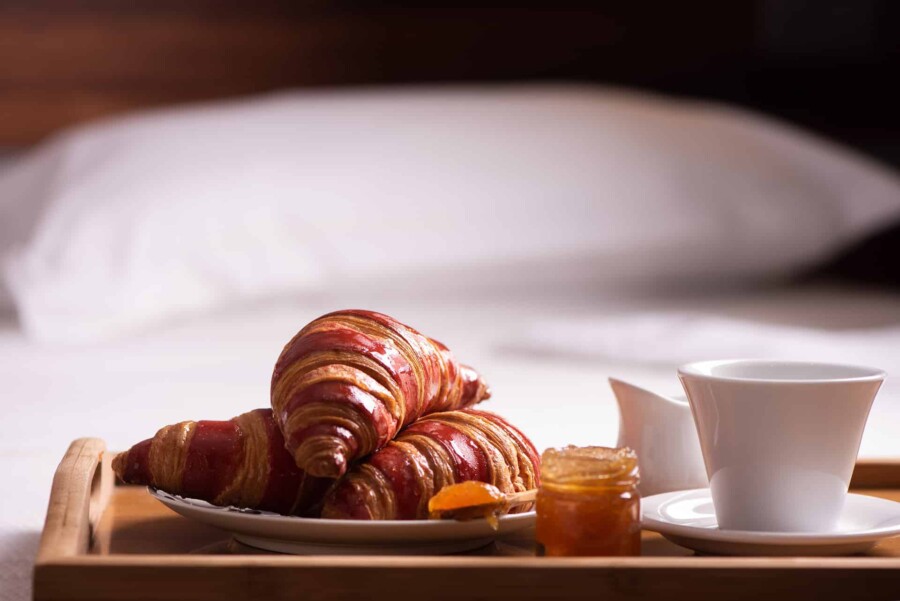 bigstock-Tray-With-Breakfast-On-A-Bed-I-361111123
